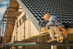 Winter roof inspection by roofing contractor